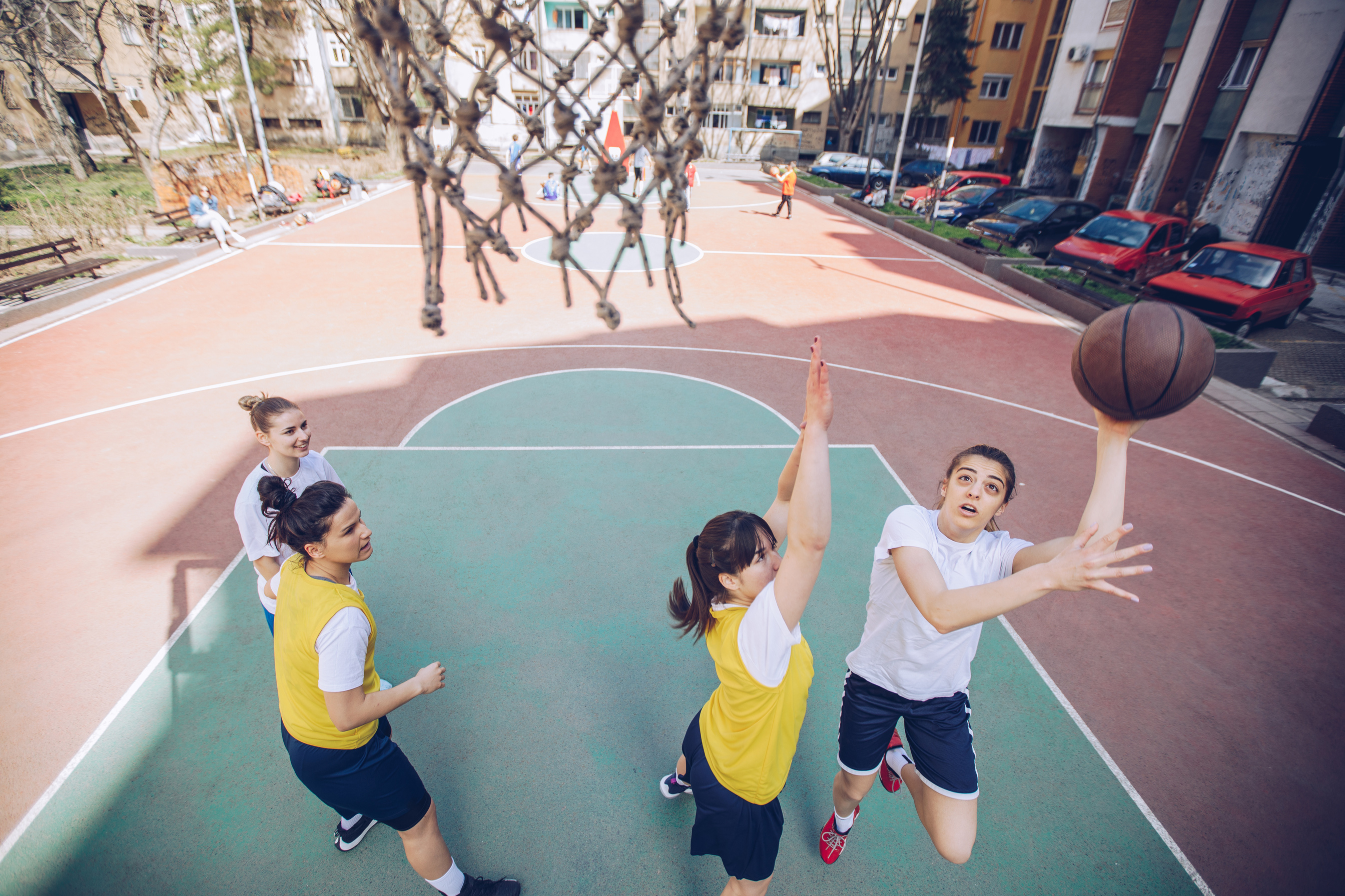 Women basketball players playing basketball